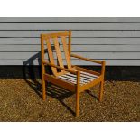 A modern Ercol armchair with slat back,