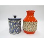 An Italian pottery 1960's vase with orange glaze and a lidded caister in blue and white.