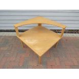 A light oak square form sofa/corner table with curved top tier,