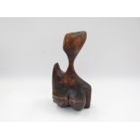 A mid 20th Century hardwood figure of a female bust in Henry Moore manner.