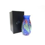 An Okra glass vase designed by Dave Barras, blue with iridescent floral detail. Marked to base.