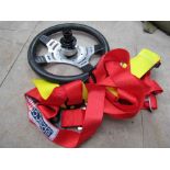 A quick release Mountney steering wheel and racing harness