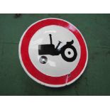 A circular enamelled tractor road sign,