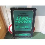 A hand painted Land Rover sign in an aluminium frame,