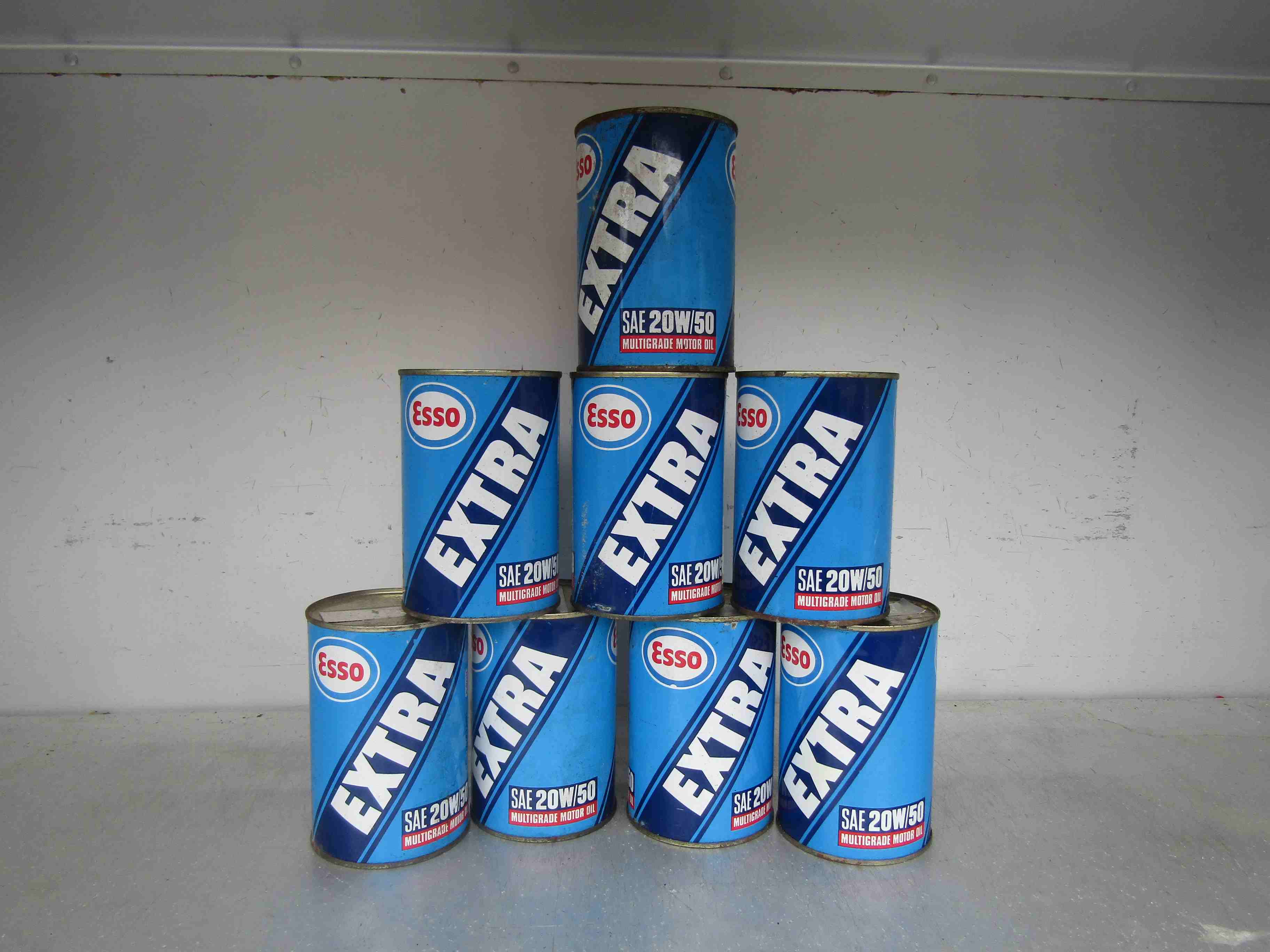 Eight unopened 1 pint tins of Esso Extra SAE 20w/50 multigrade motor oil