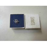 A boxed Rolls Royce pin badge