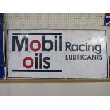An over painted tin sign 'Mobil oils racing lubricants' 50cm x 100cm