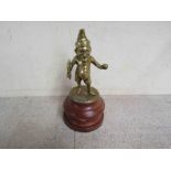 A brass Mr Punch mascot mounted on a turned plinth