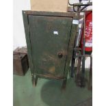 A metal single door cupboard