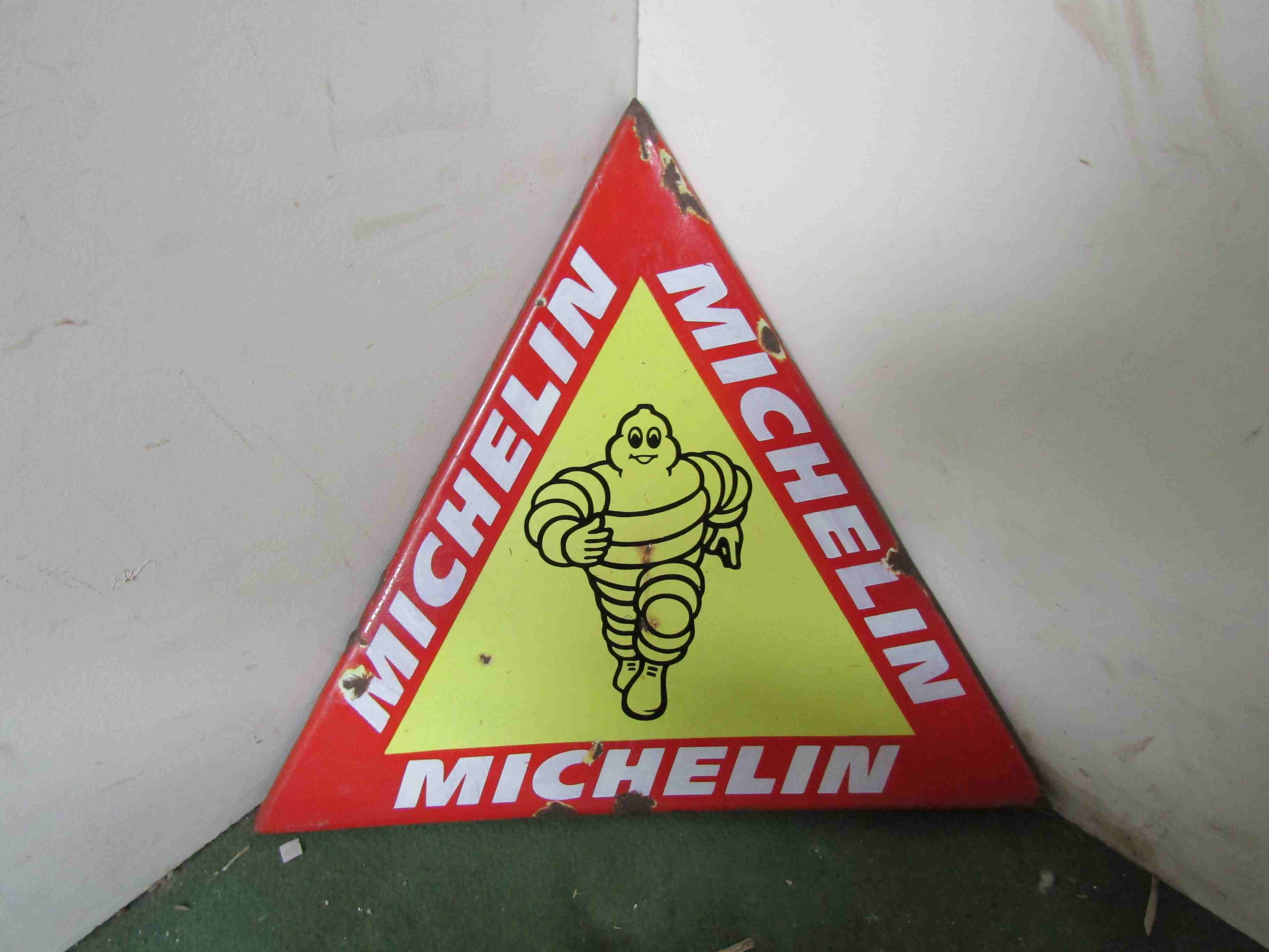An enamelled and over painted triangular Michelin sign 43cm x 50cm