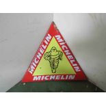 An enamelled and over painted triangular Michelin sign 43cm x 50cm