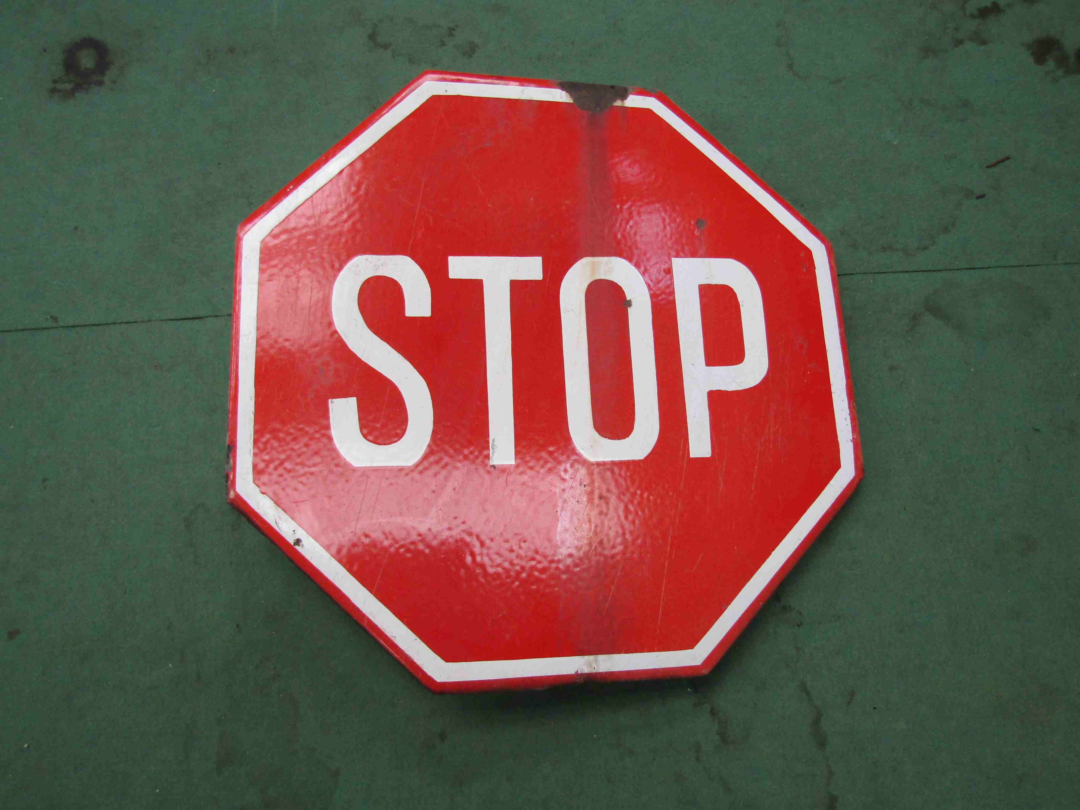 An enamelled hexagon "Stop" sign 60cm x 60cm