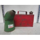 Red metal fuel can and castor oil jug