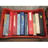 A box of vehicle workshop manuals including A40,