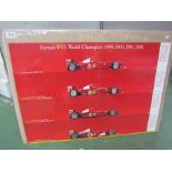 Two Ferrari F1 Champion posters covering years 1999, 2000, 2001 and 2002, 68cm x 98cm.