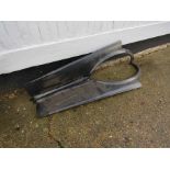 A pair of Jaguar XJ6 wheel arches,