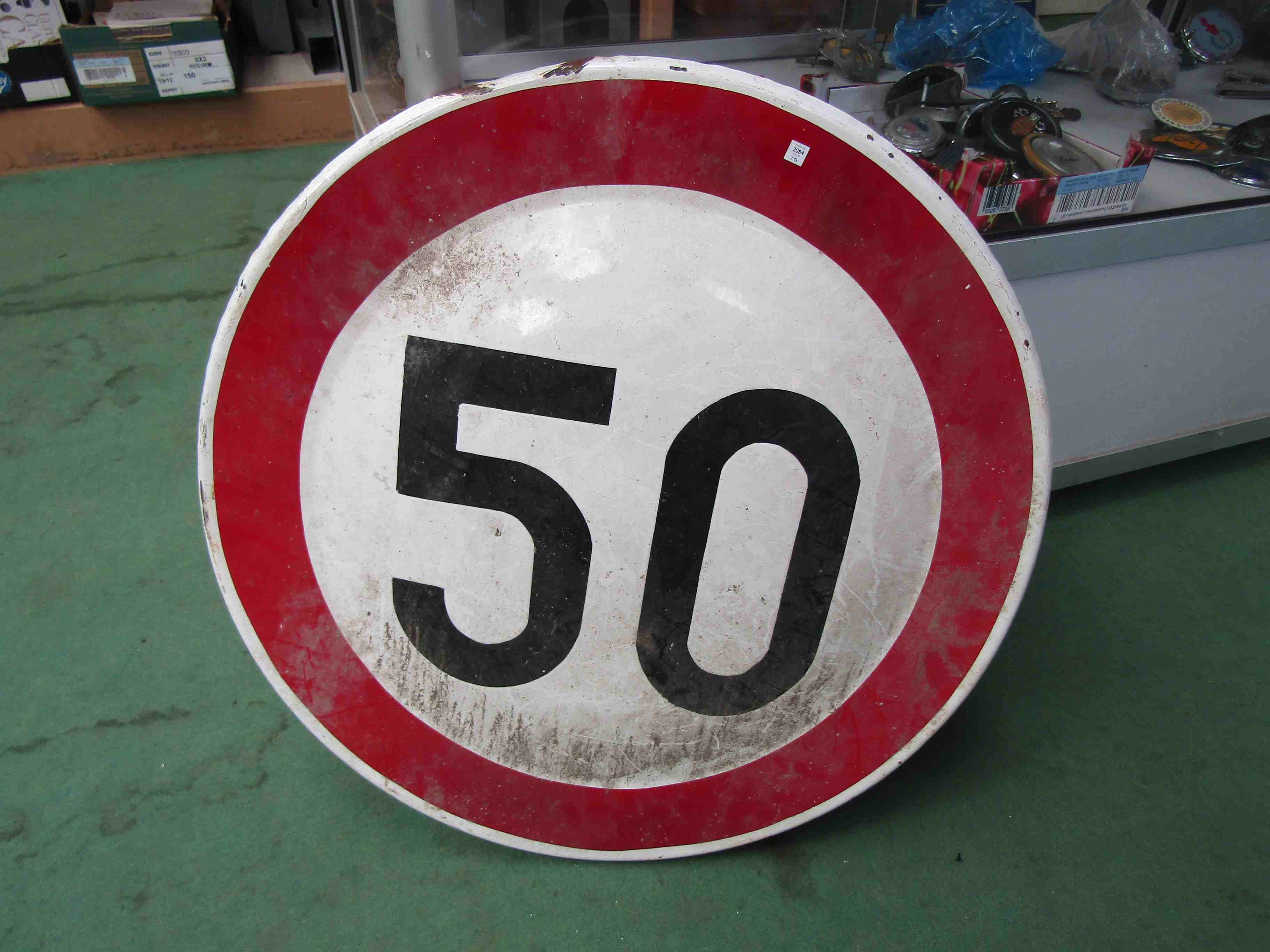 A circular 50mph road sign,