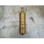 A vintage brass 'Pyrene' fire extinguisher