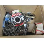 A box containing chromed mirror, head lamp guard,