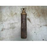 A vintage copper Nu Swift fire extinguisher