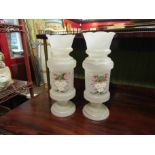 A pair of hand painted glass vases,