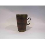 A banded copper and wood beaker