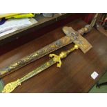 A decorative Malaysian Kris knife with carved gilt wood scabbard and a repro Spanish dagger