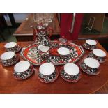 A porcelain coffee service and tray, hand painted Eastern style decoration in black,