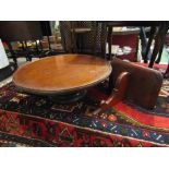 A mahogany Lazy Susan with dished top and a wall bracket