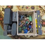 A box of binoculars, tripod, ornaments,