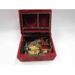 A small jewellery box with some contents including brooch, thimble,