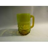 A yellow vaseline glass 1 pint tankard circa 1940's