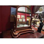 A Victorian mahogany dressing mirror on shaped base