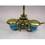 A late Victorian brass three condiment serving set with turquoise pots and integral bell for