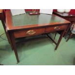 A 19th Century mahogany writing desk the tooled leather insert and rising leaves over two frieze
