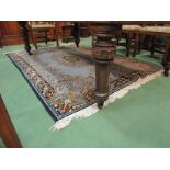 A pale blue foliate design rug,