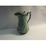 An earthenware jug with Victorian lozenge mark decorated with huntsman,