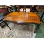 An inlaid kingwood occasional table on cabriole legs with brass ormolu mounts,