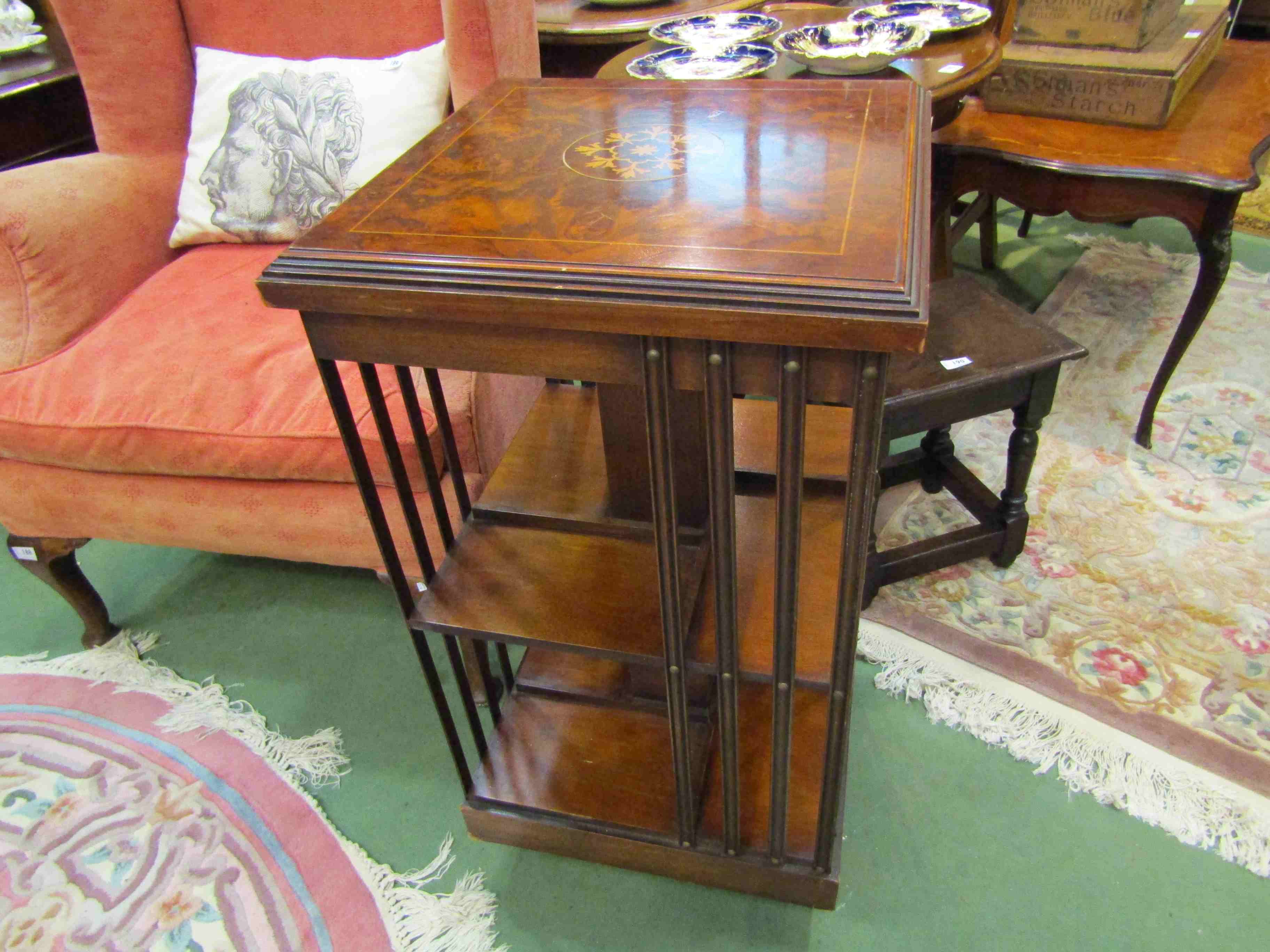 An inlaid walnut and mahogany revolving bookcase,