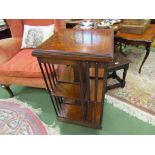 An inlaid walnut and mahogany revolving bookcase,