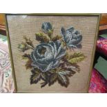 A beadwork picture of floral specimens,