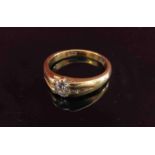 A gold ring set with a single diamond .35ct approx, stamped 18ct.