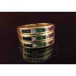 A gold ring with three rows of sapphires, diamonds and emeralds, stamped 18k. Size Q/R, 7.