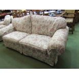 A Multiyork two seater sofa with floral upholstery