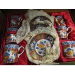 A cased Oriental coffee set