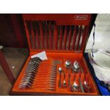 A cased Oneidacraft stainless steel modern design cutlery set