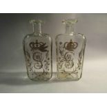 A pair of George III gilt engraved decanters,