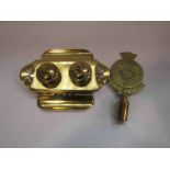 A brass twin inkwell and "The Girls Life Brigade" brass flagpole top