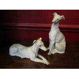 Two porcelain lurcher figures