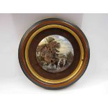 A framed paste pot lid with country scene